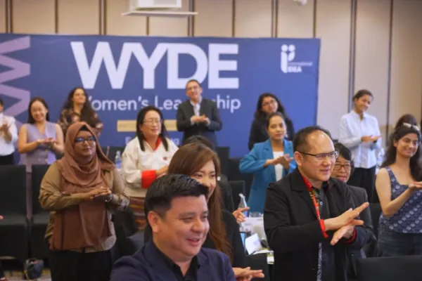 a WYDE meeting with people stand up