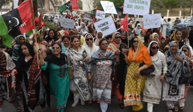 Women political activists hold placards as they march during a rally to mark International Women’s Day in Karachi, Pakistan. 