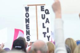 Participants in New Bern's 2017 Women's March hold up signs in support of women's equality.  TODD WETHERINGTON / SUN JOURNAL STAFF