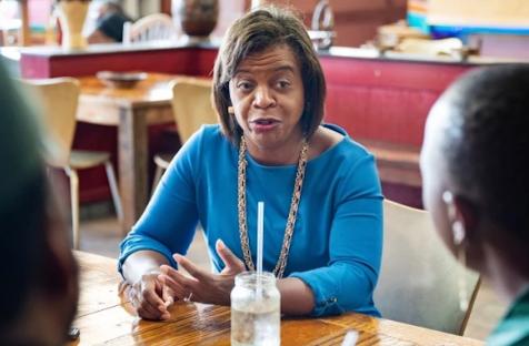 Cheri Beasley, a Democratic U.S. Senate candidate, speaks with the owners of Zwelis, a Zimbabwean restaurant, in Durham, N.C., on July 7, 2021.Getty Images file